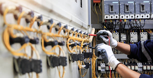 Professional Electrician technician working in The Pinehills, MA